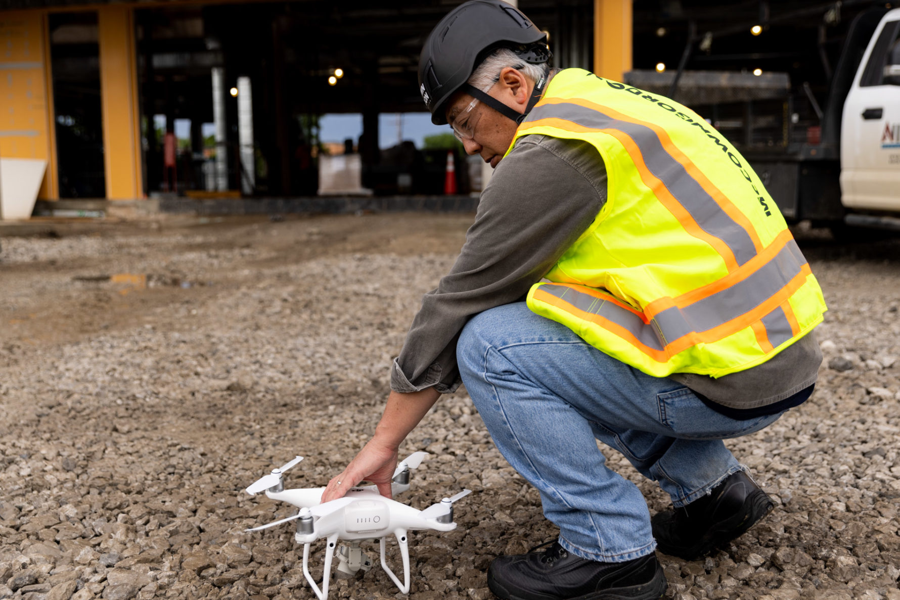 A McCownGordon Construction associate preparing to fly a drone on a job site