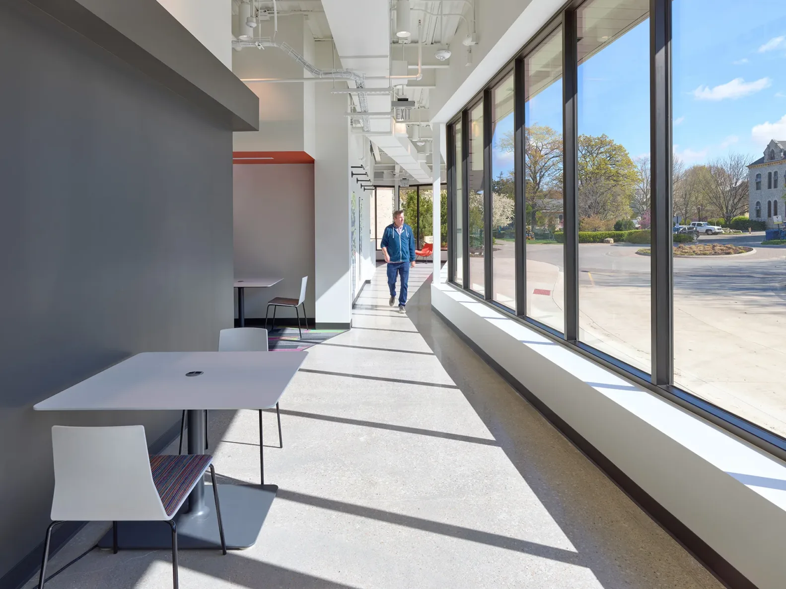 A long hallway with windows in the KSU Morris Family Multicultural Student Center