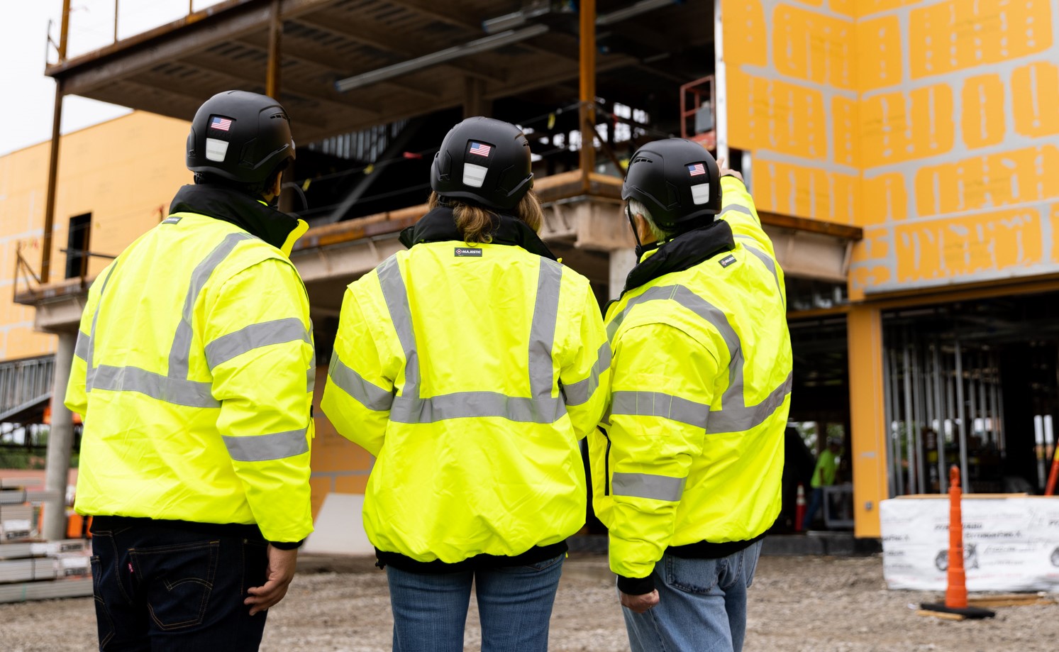 Three McCownGordon Construction associates looking at the progress on a job site