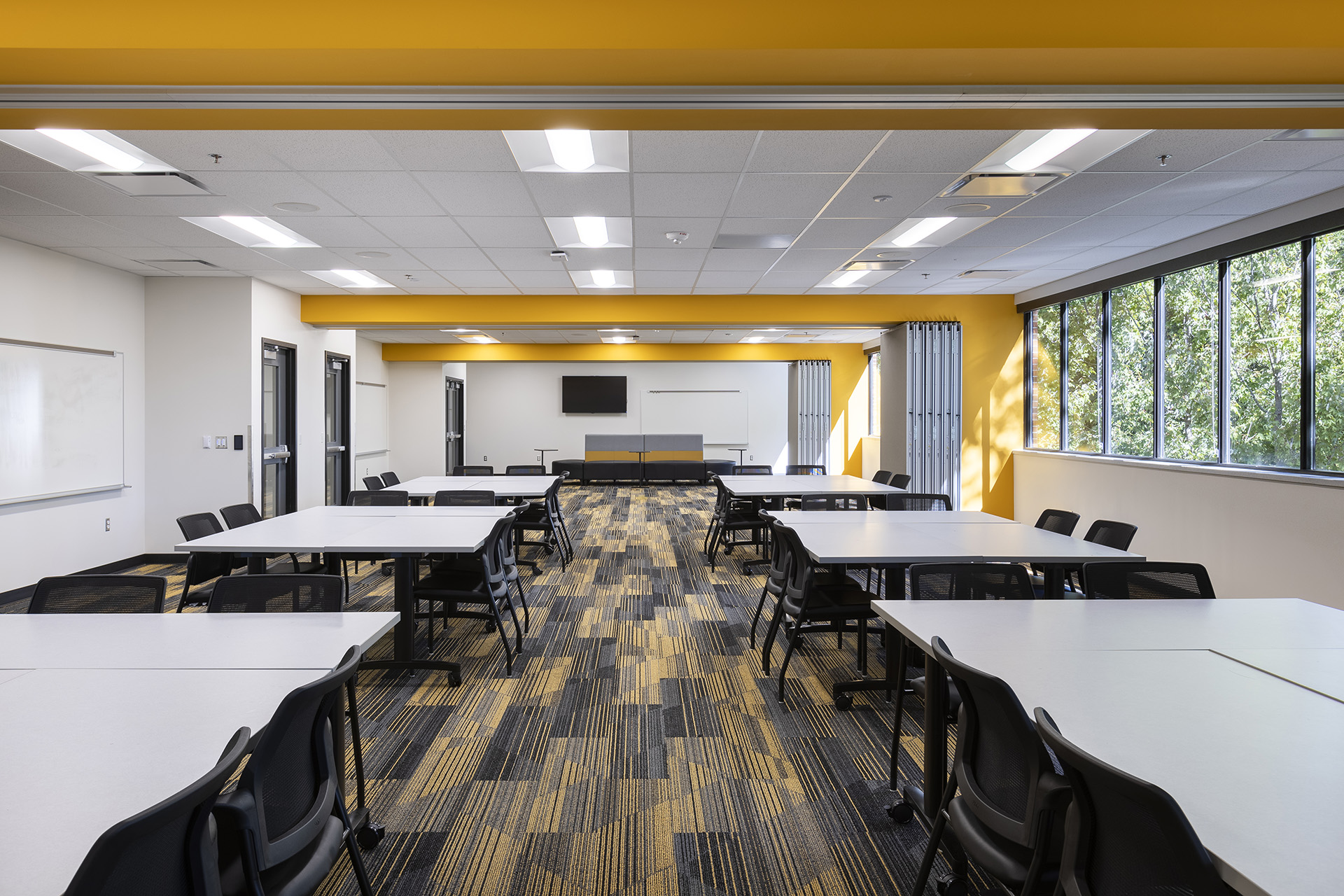 Empty tables used for collaboration space at the Hickman Mills Real World Learning Center.