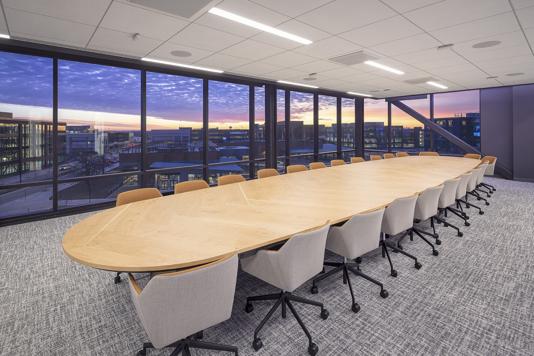 Empty conference room with sun setting in background at Walmart's Sam Walton Hall