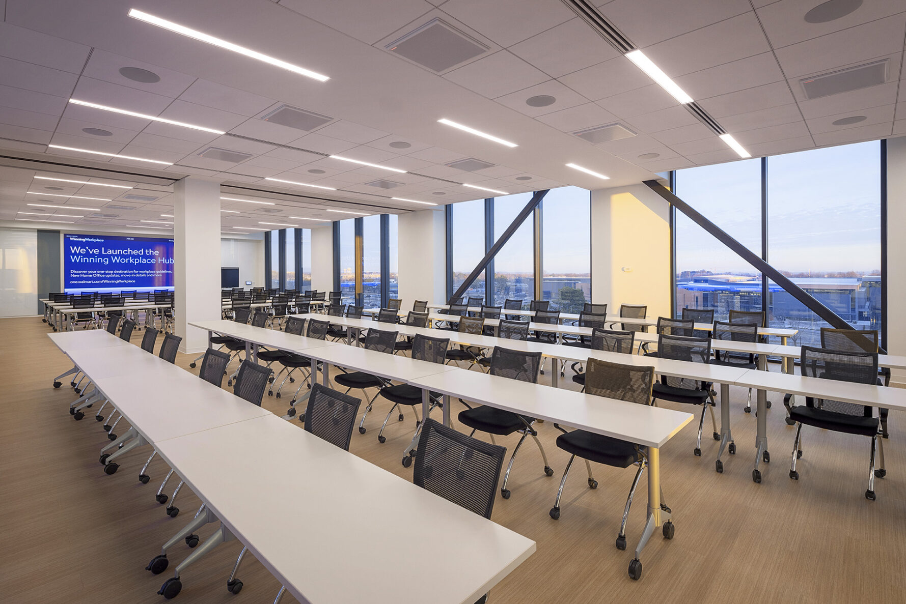 Empty conference seating tables in Walmart's Sam Walton Hall, built by McCownGordon Construction