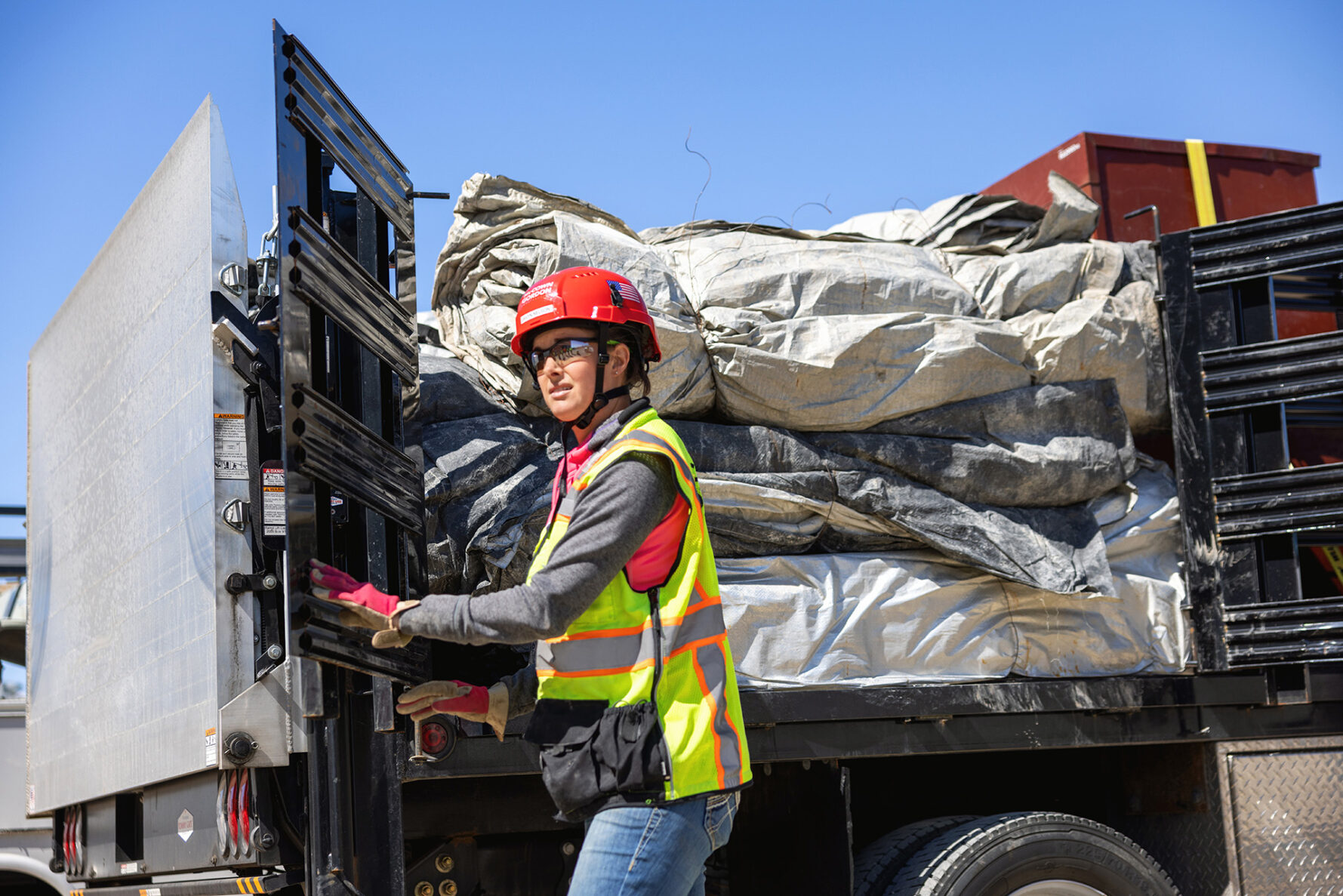McCownGordon construction worker delivering materials on truck.