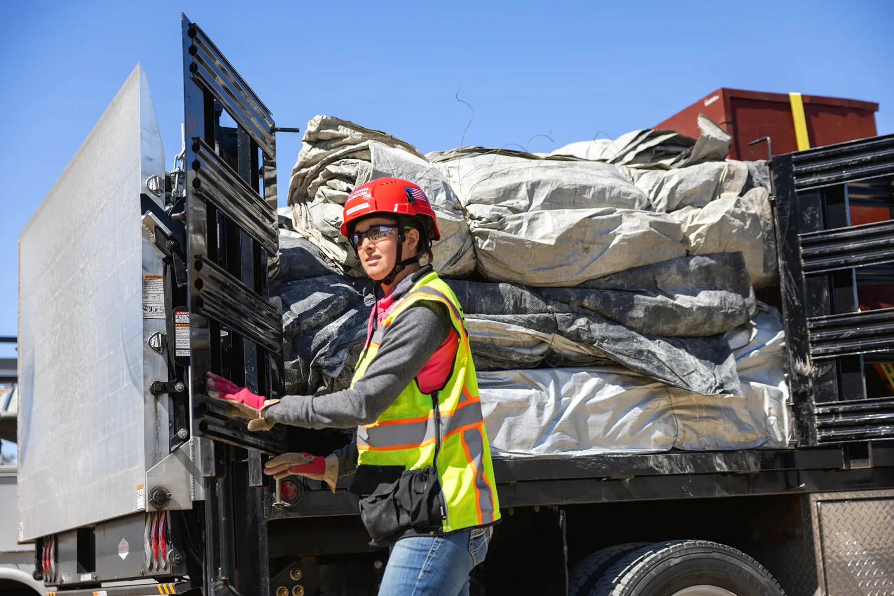 McCownGordon construction worker delivering materials on truck.