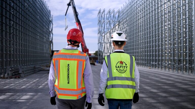 McCownGordon associate walking with an owner on an industrial manufacturing jobsite