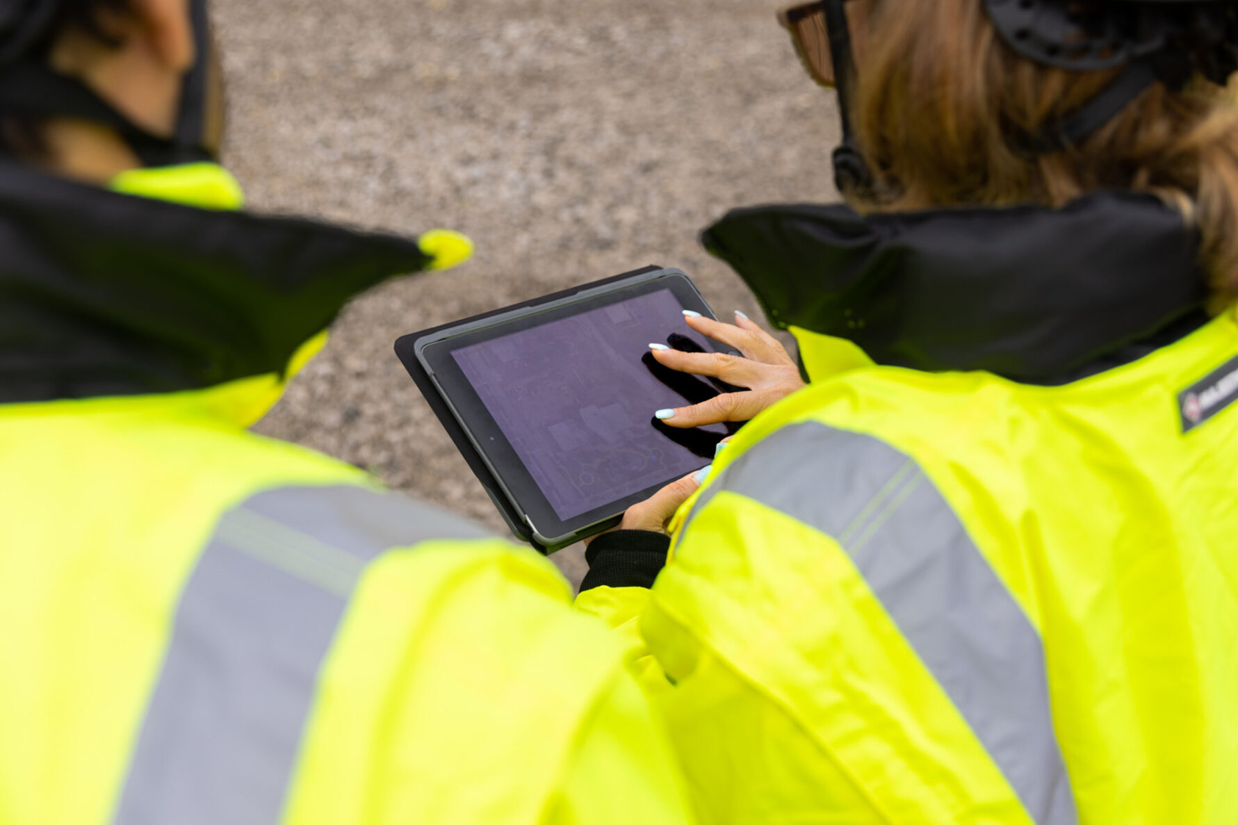 McCownGordon associates working on jobsite using technology.