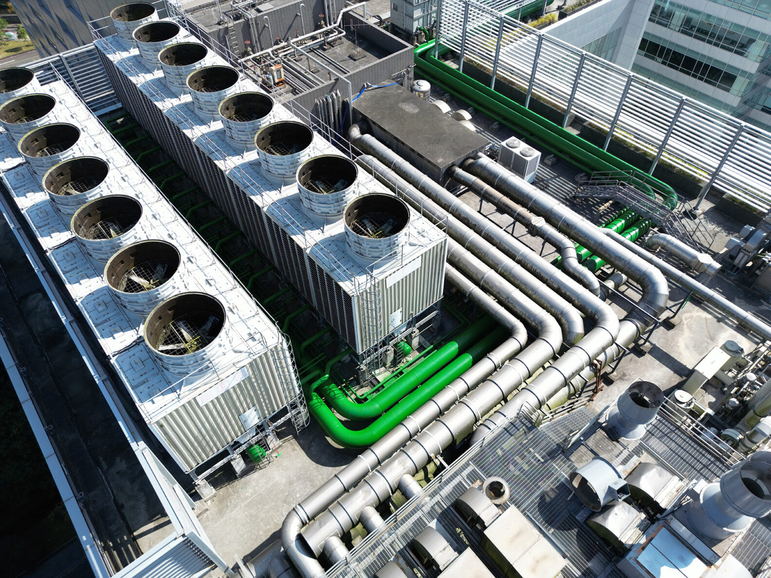Aerial view of complex industrial piping and cooling towers